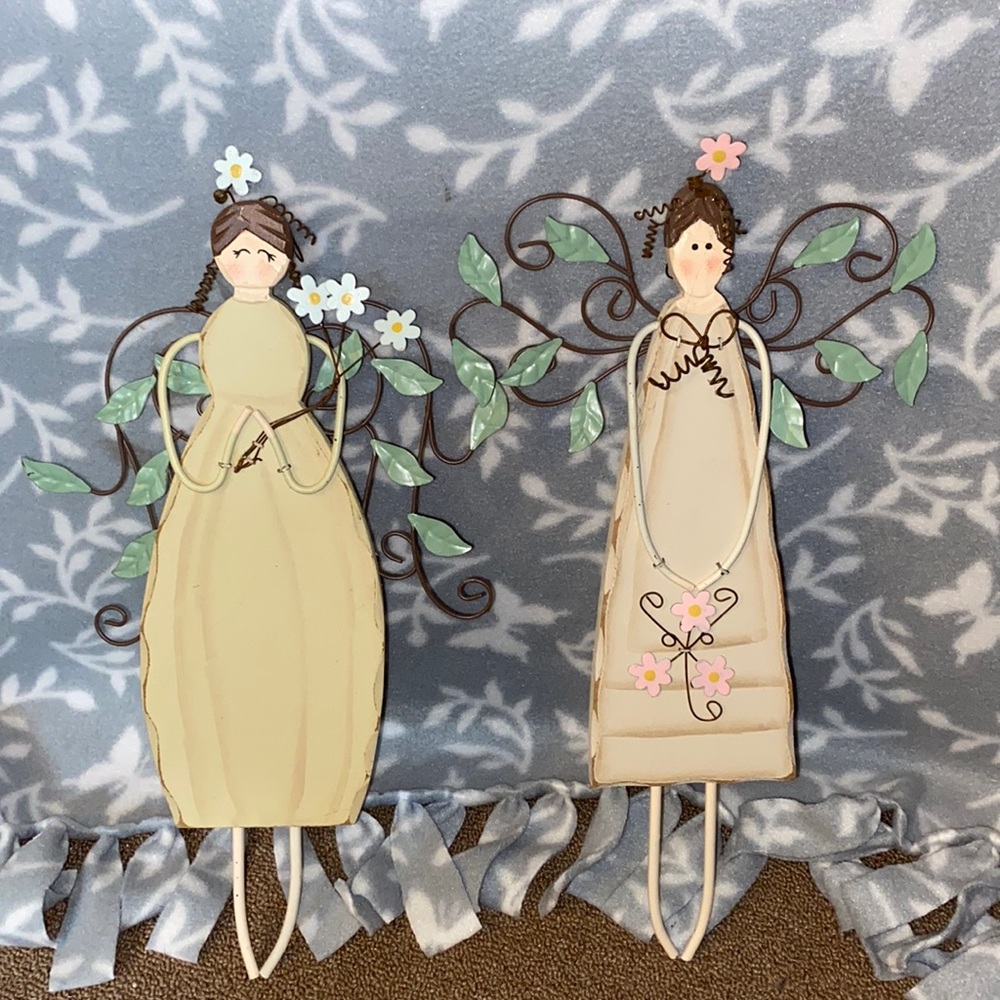 Pair of wooden wall hangings.